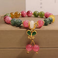 Women's tourmaline butterfly pendant bracelet with natural jade colour stones and rhinestone accents