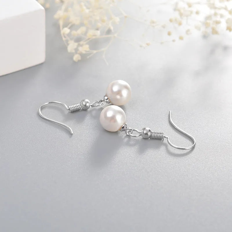 Women's white gold plated geometric high imitation pearl stud earrings on copper base