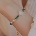 Traditional Chinese bamboo joint bracelet with Hetian jade and copper shell pearls