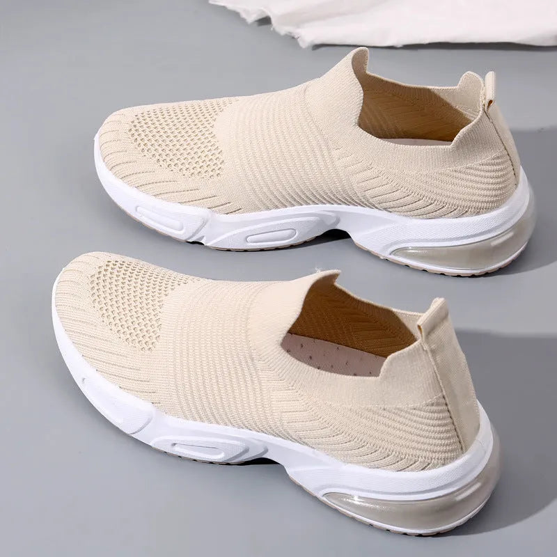 Breathable mesh slip-on lazy sock shoes in black, pink, khaki, and white colours on a PVC sole.