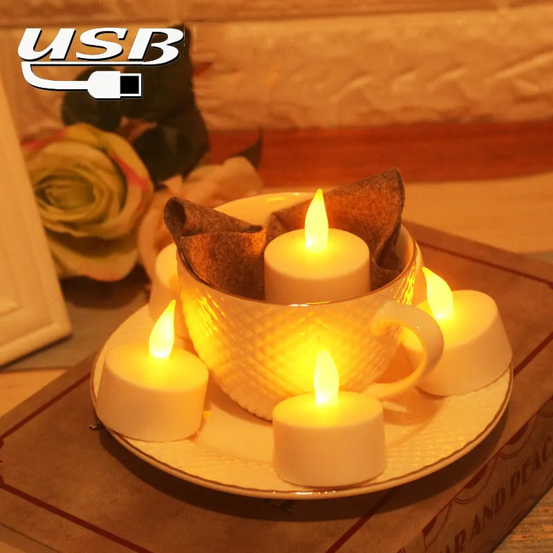 White plastic rechargeable LED candle lamp with yellow glowing flame on a table.