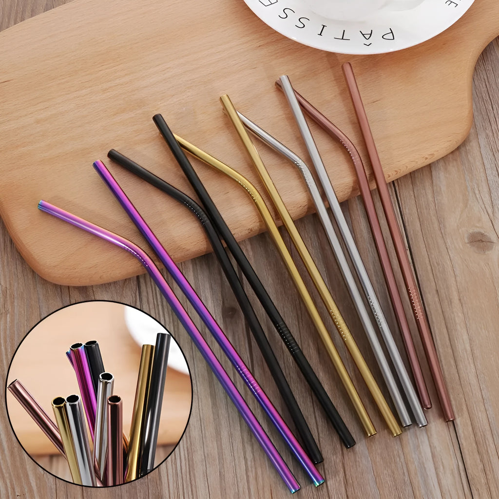 Set of four reusable stainless steel straws and a cleaning brush in silver, gold, rose gold, and blue colours.