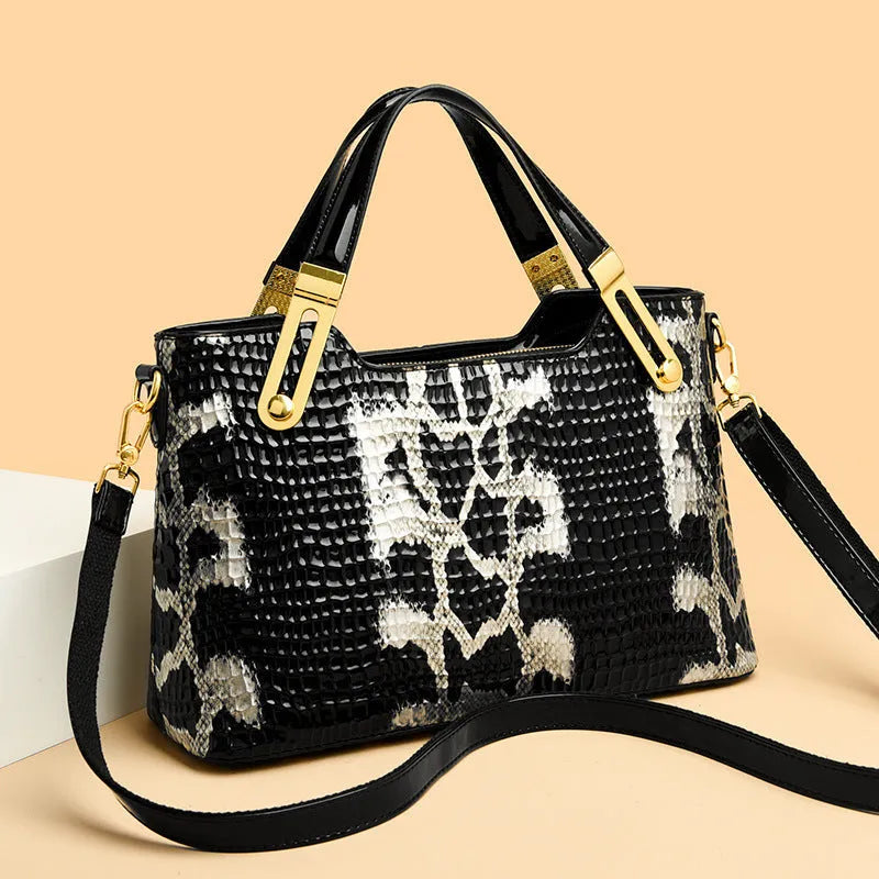 Black horizontal square messenger bag with chain strap and multiple compartments