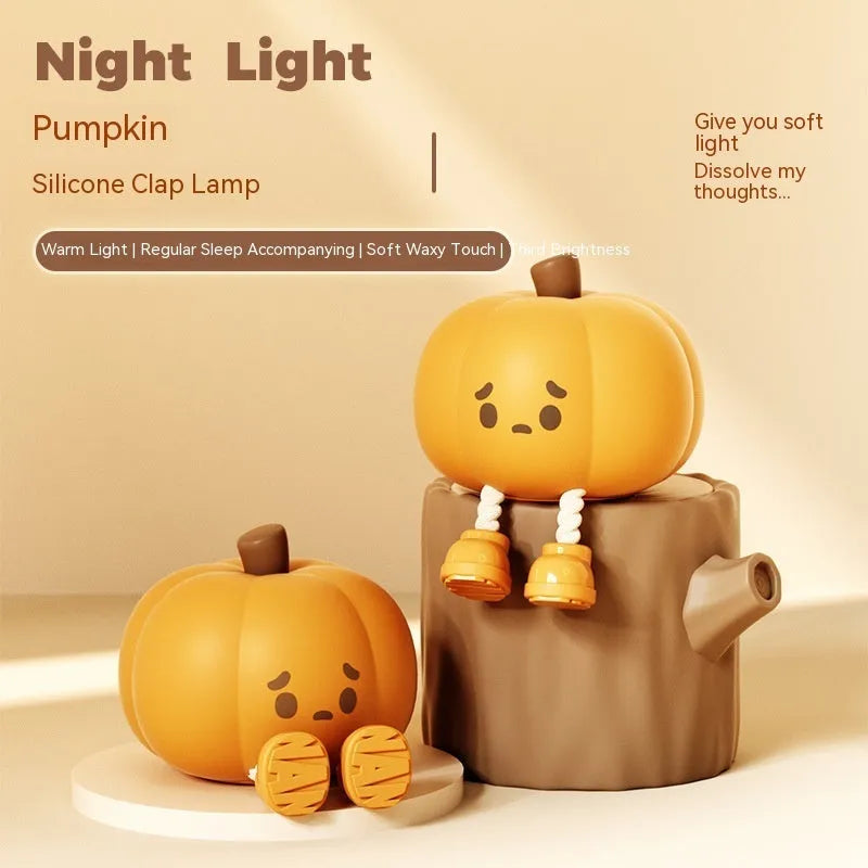 Soft silicone pumpkin-shaped night light with dimmable touch control on bedside table