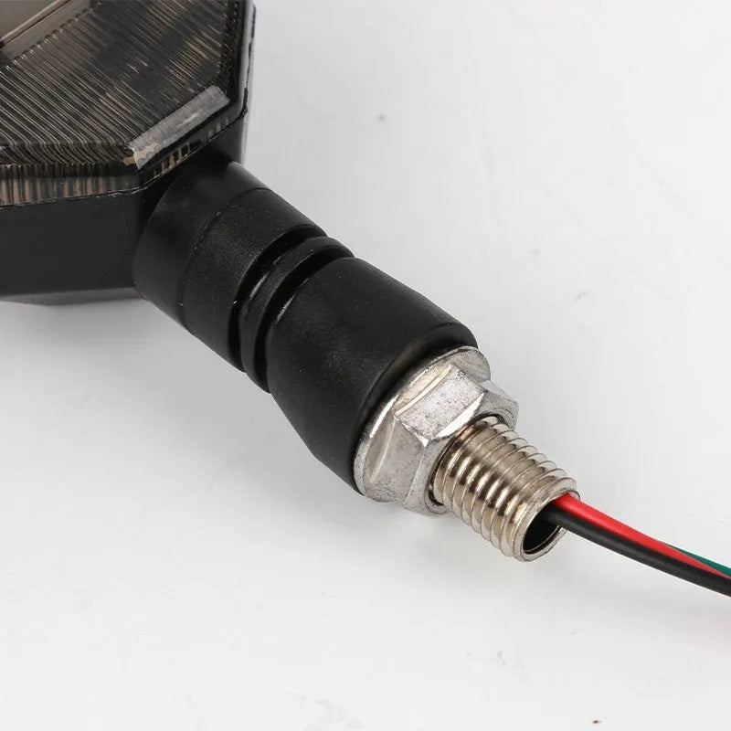 Arrow-shaped LED motorcycle turn signal lamp with 12V universal fitment and ABS plastic housing