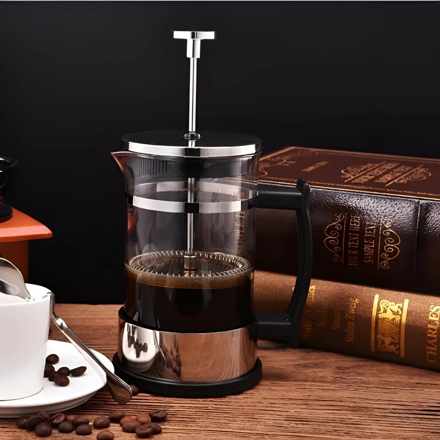 Compact stovetop espresso maker with glass upper section and stainless steel base