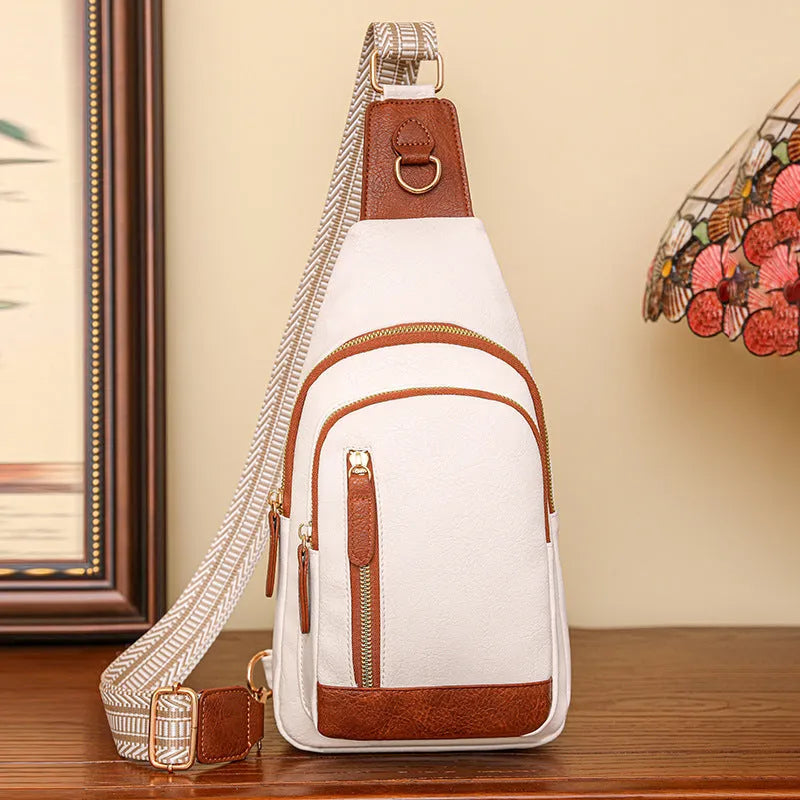 Soft brown women's crossbody messenger bag with an outer open pocket and adjustable strap.