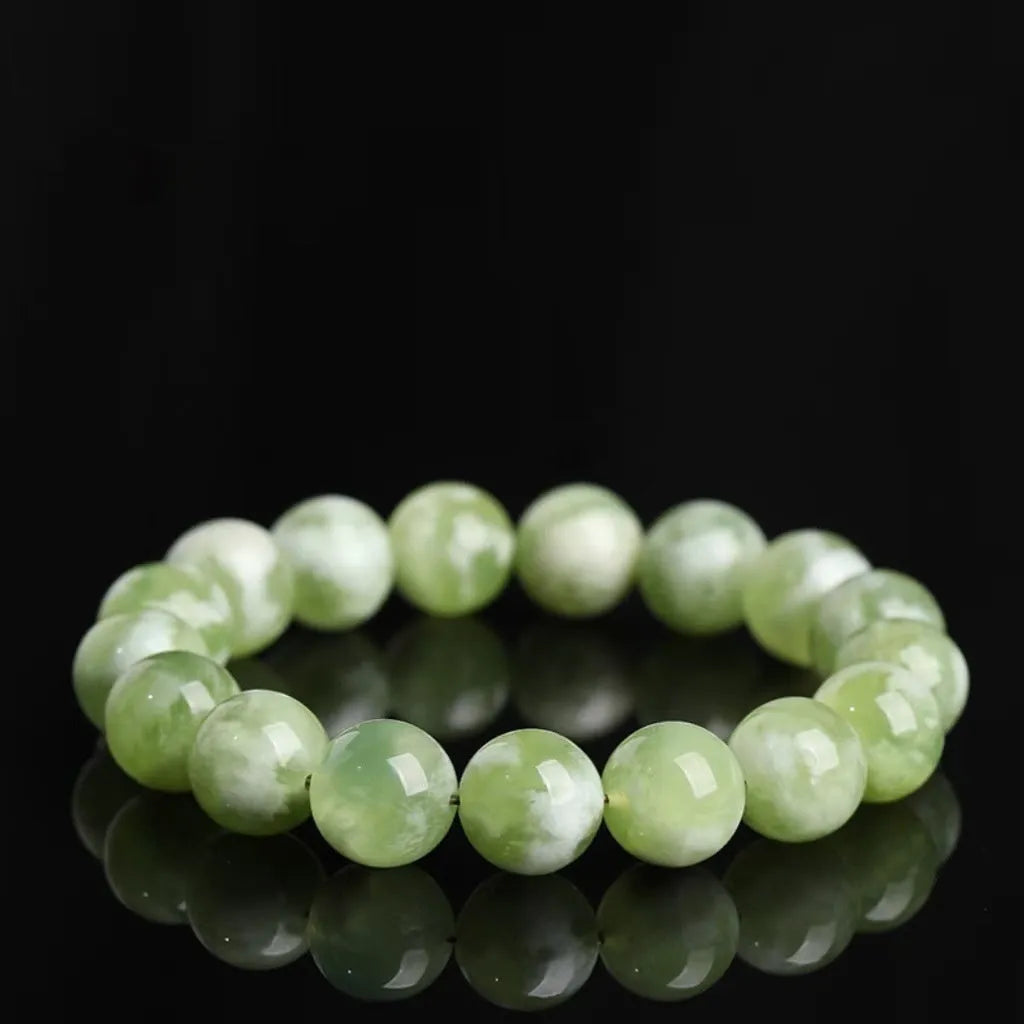 Green milk-in-water Xiuyan jade bracelet with polished finish and geometric unisex styling