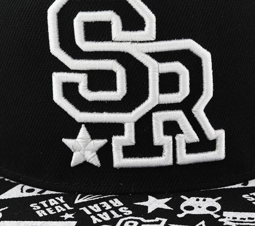 White cotton baseball cap with embroidered lettering on the front, showing the adjustable strap at the back.