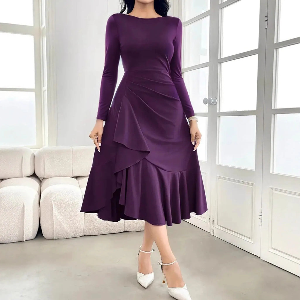 Purple women's long sleeve dress with ruffle detail and a round neck.