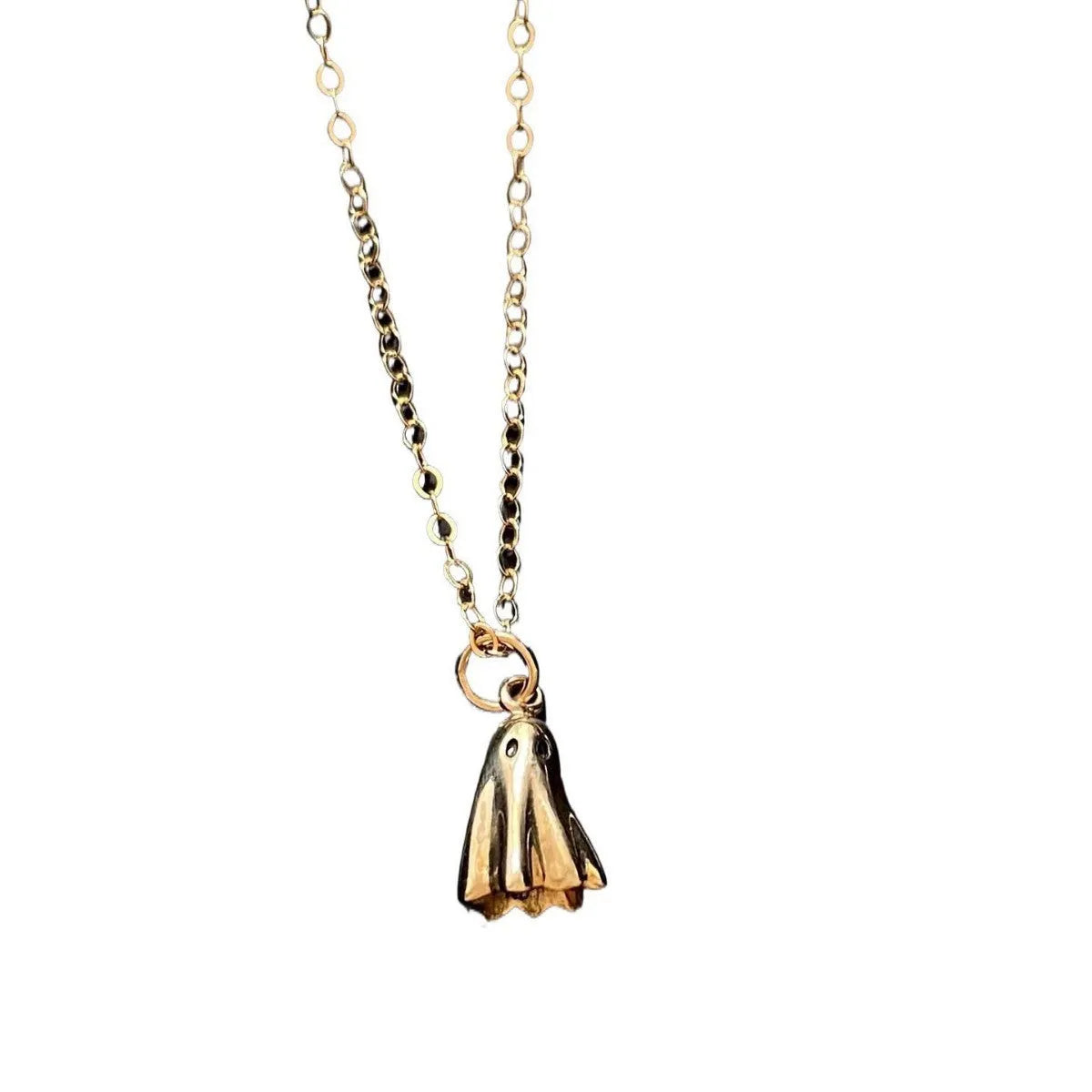 Ghost pendant necklace with twisted stainless steel chain on a person.