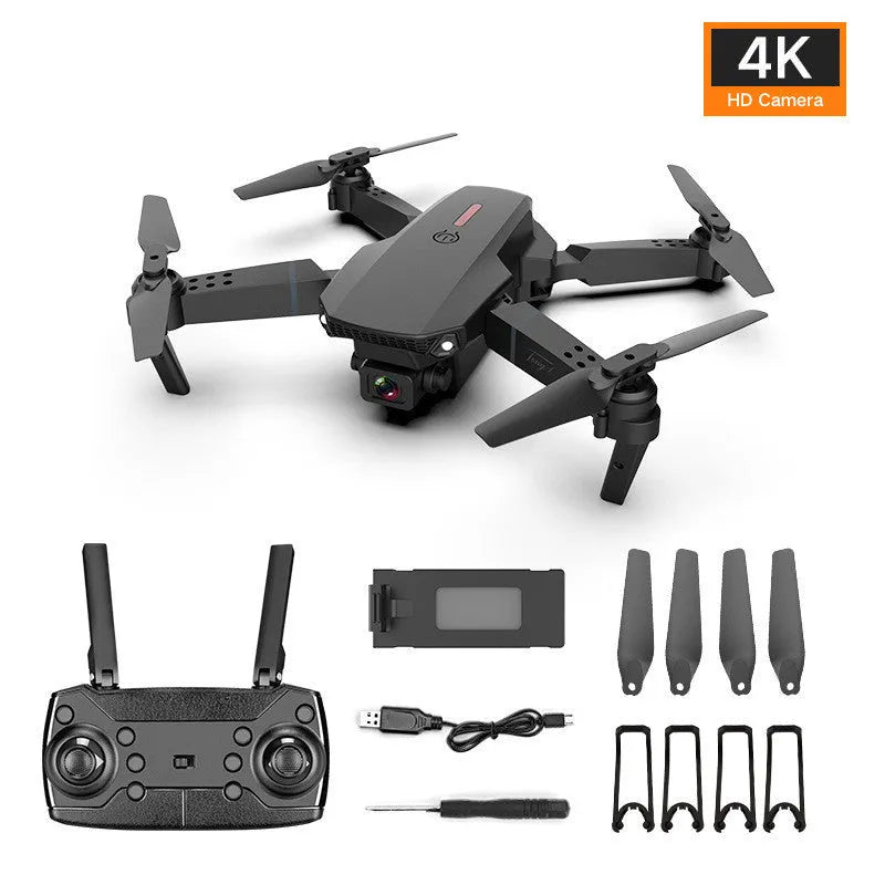 Grey foldable remote control drone with dual 4K cameras, LED lights, and a handheld transmitter.