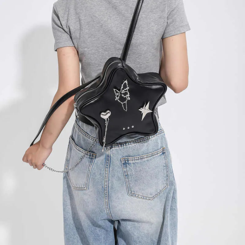 Soft PU leather women's mini backpack in black, shown being worn cross-body.