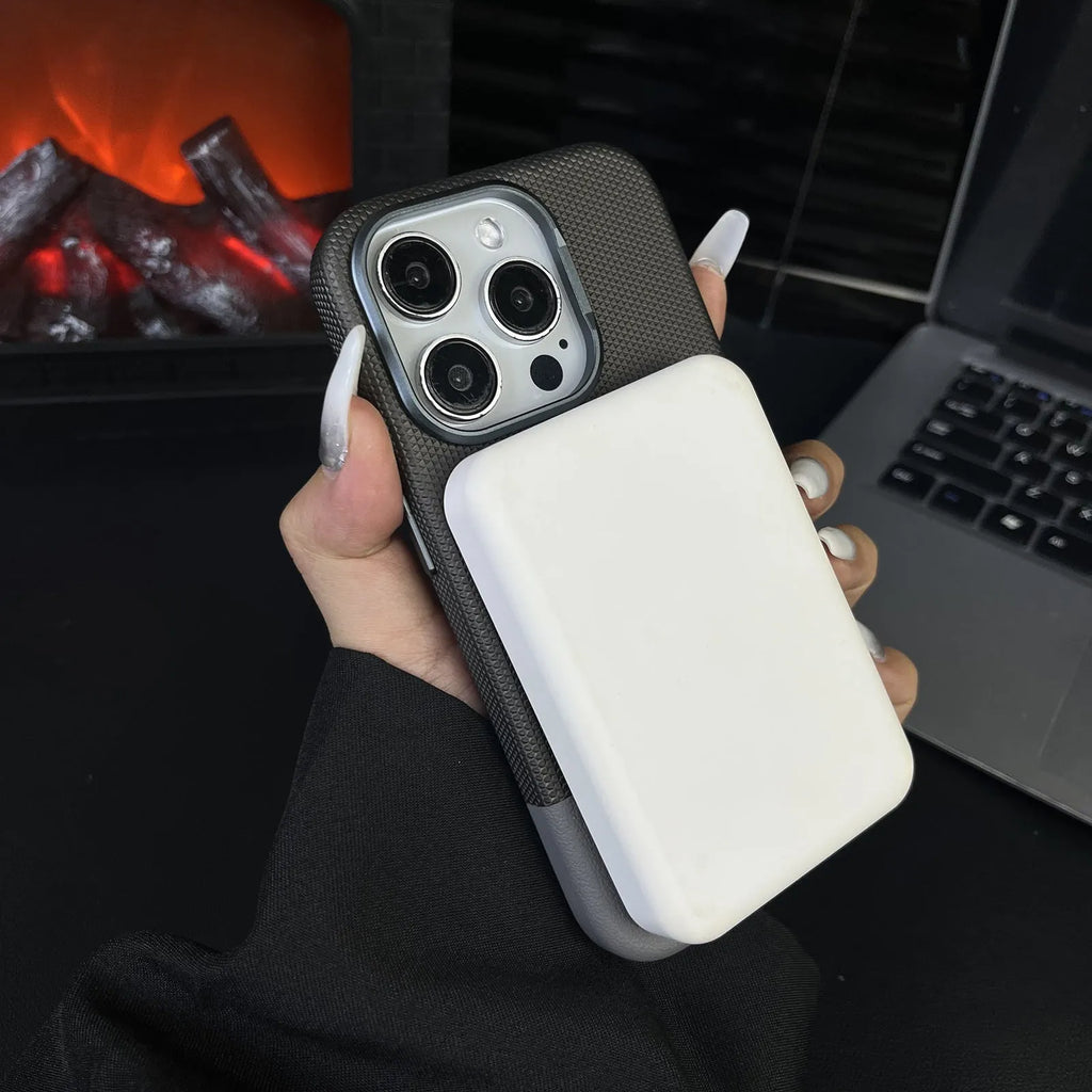 Black magnetic iPhone case with dragon scale texture and leather-style stitching, shown on an iPhone 15 Pro Max.