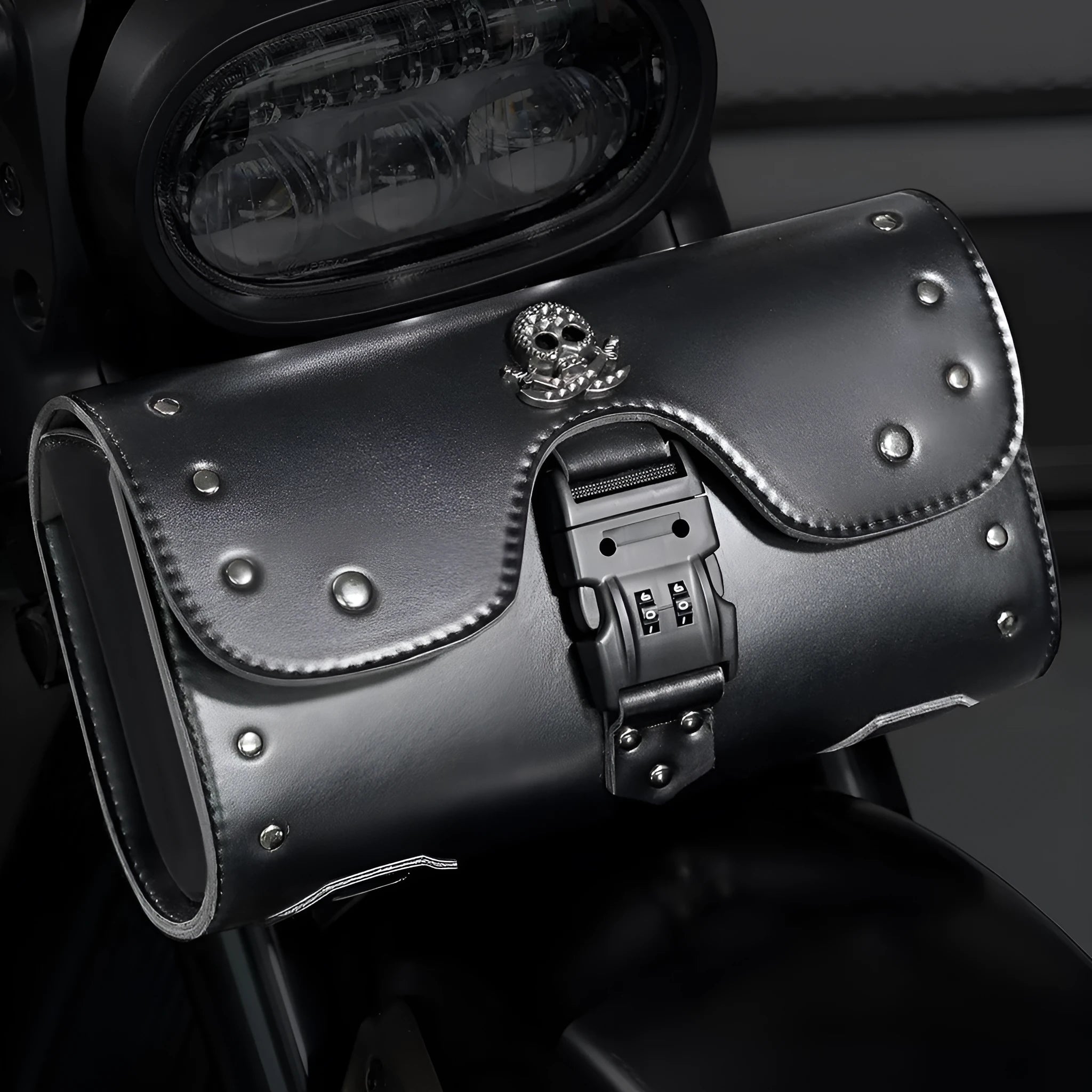 Black PU motorcycle pannier saddlebag mounted on the side of a retro-style bike.
