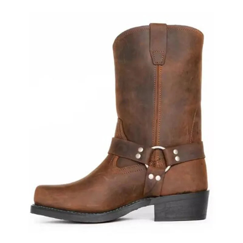 Men's brown vintage cowboy boots with a large silver belt buckle ring detail on the side.