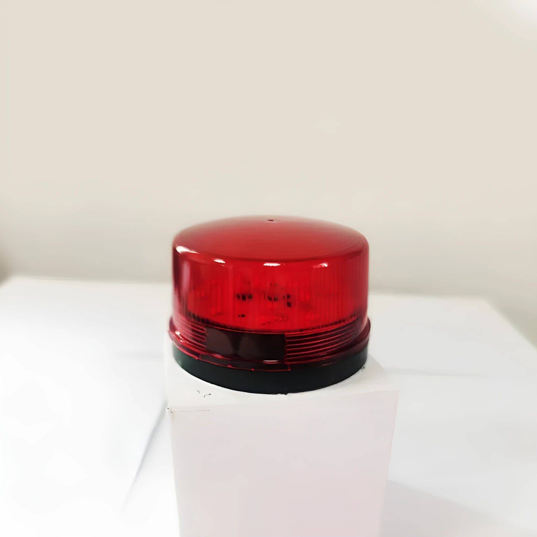 Small red 24v warning and alarm light with siren, 73mm diameter, on a white base.