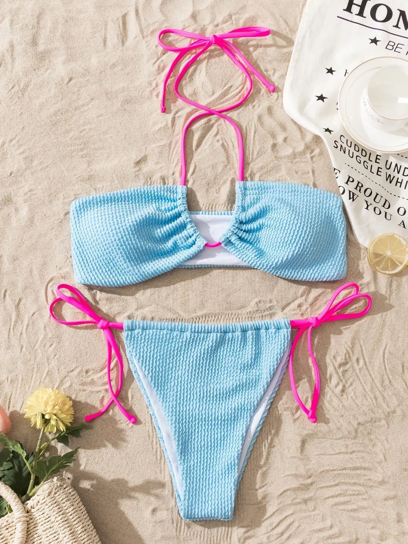 Women's solid colour halter neck lace-up separated two-piece swimsuit on a model.