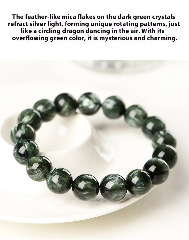 Natural green dragon crystal bead bracelet with geometric ruyi pattern on white background.