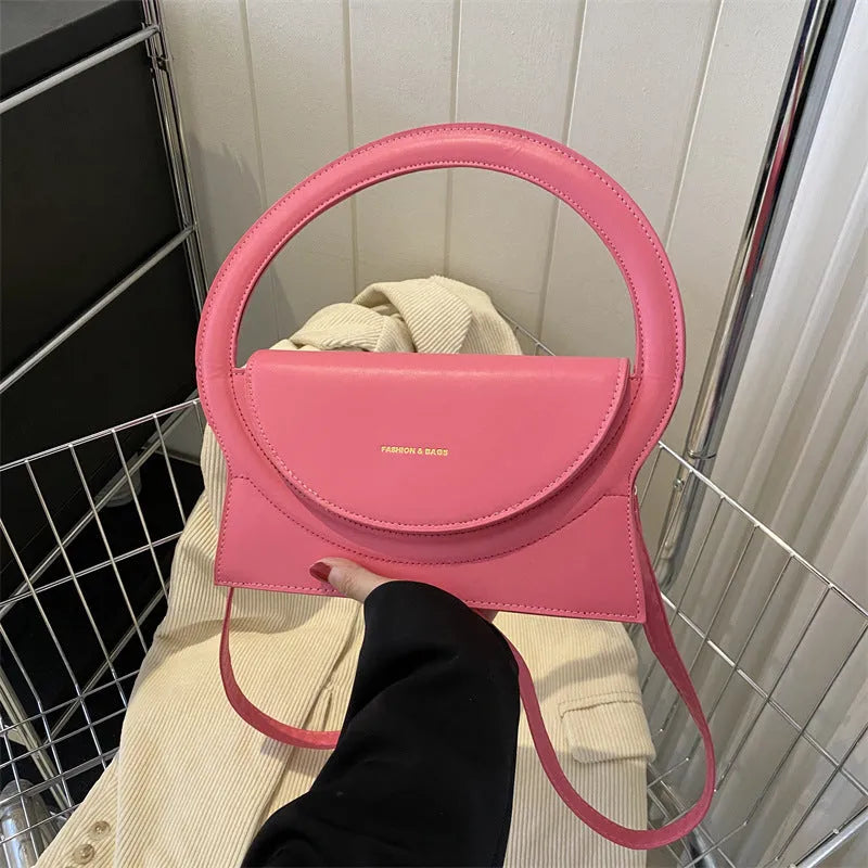 Horizontal square PU messenger bag showing sandwich pocket design and stitching details