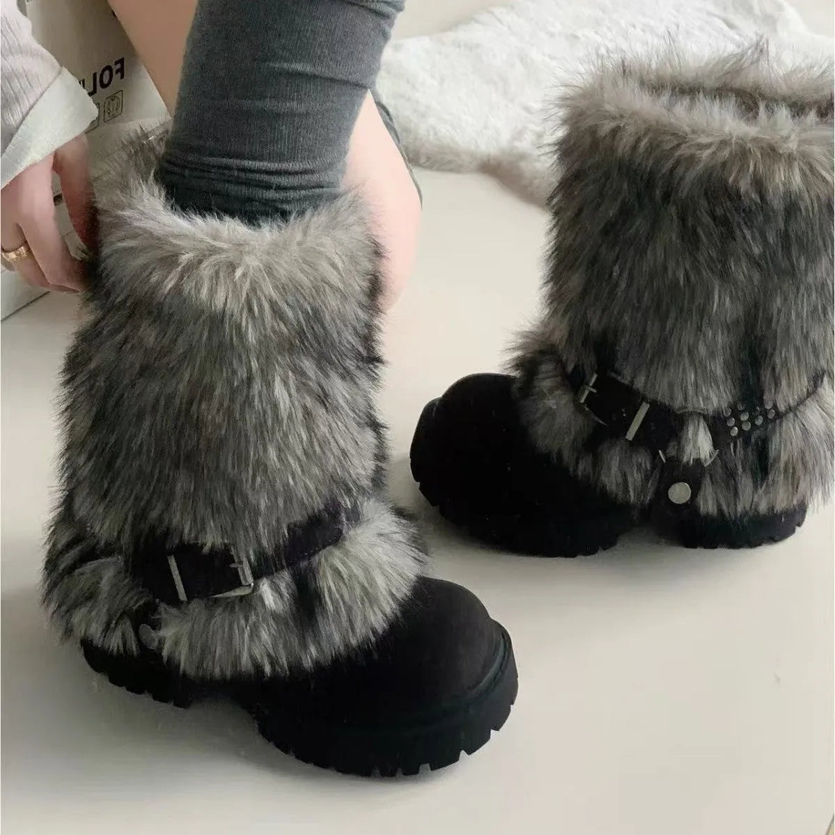Women's winter snow boots in beige with artificial plush upper, thick rubber sole, and mid-calf shaft
