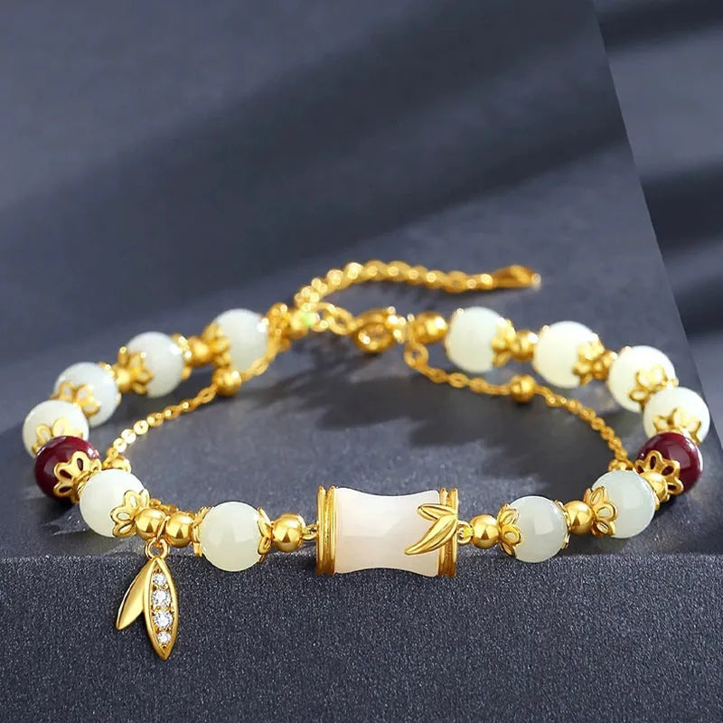 Bamboo-themed glass bracelet with coloured glaze beads and electroplated flower charm