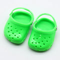 Blue, red, yellow, and green plastic doll beach slippers fashion accessory.