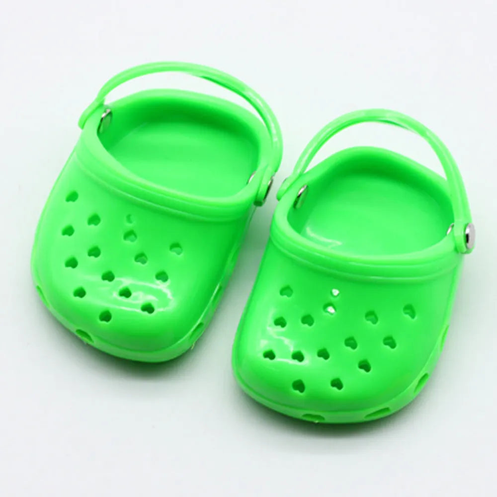 Blue, red, yellow, and green plastic doll beach slippers fashion accessory.