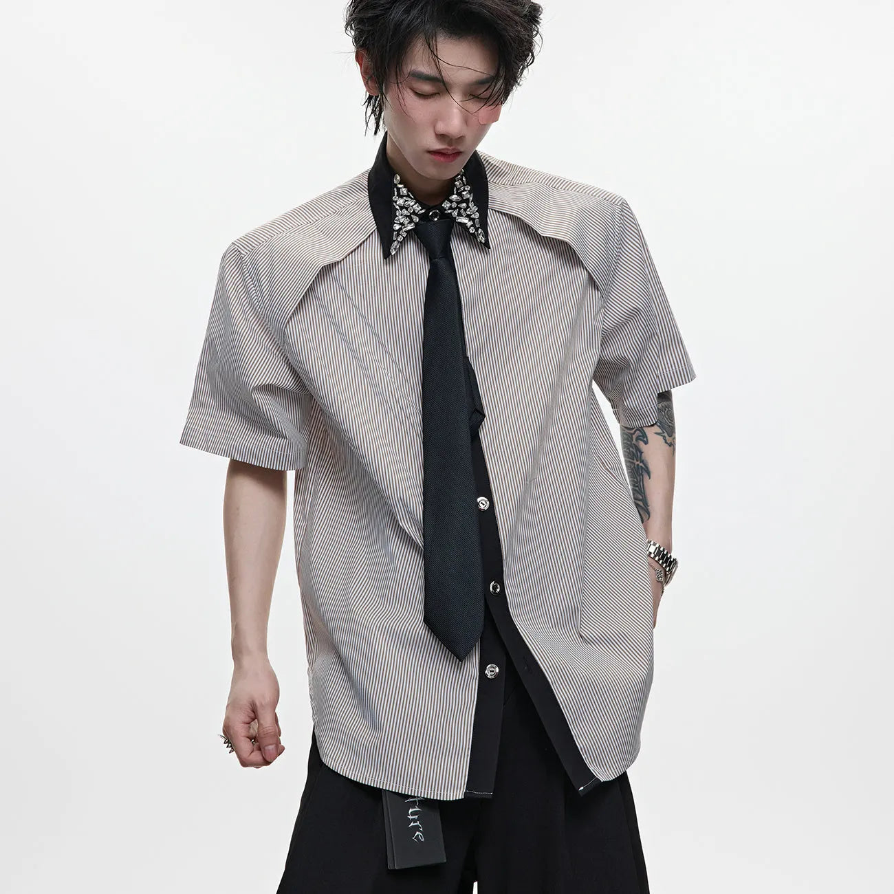 Men's blue and khaki loose fit shirt with diamond tie and patchwork striped pattern.