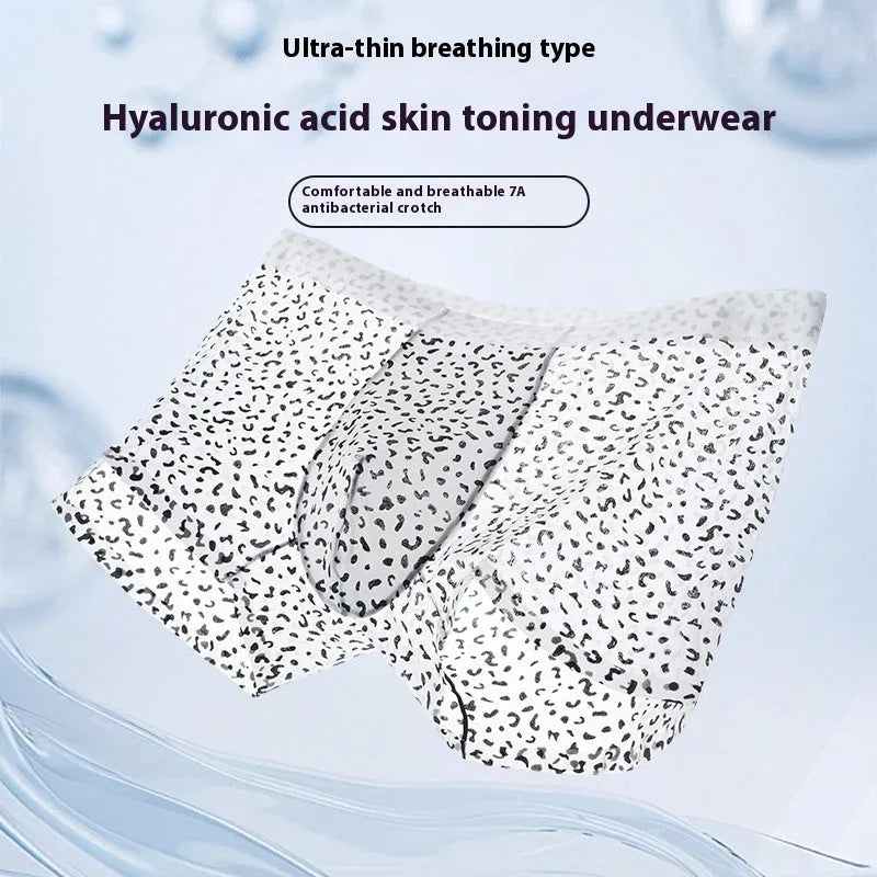 Men's black leopard print ice silk boxers laid flat, showing mid-waist design and knitted fabric texture.