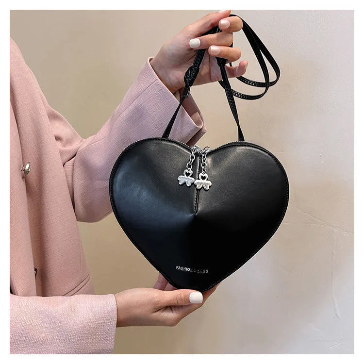 Heart shape women's shoulder bag in milky white PU with single crossbody strap and sewing line detail