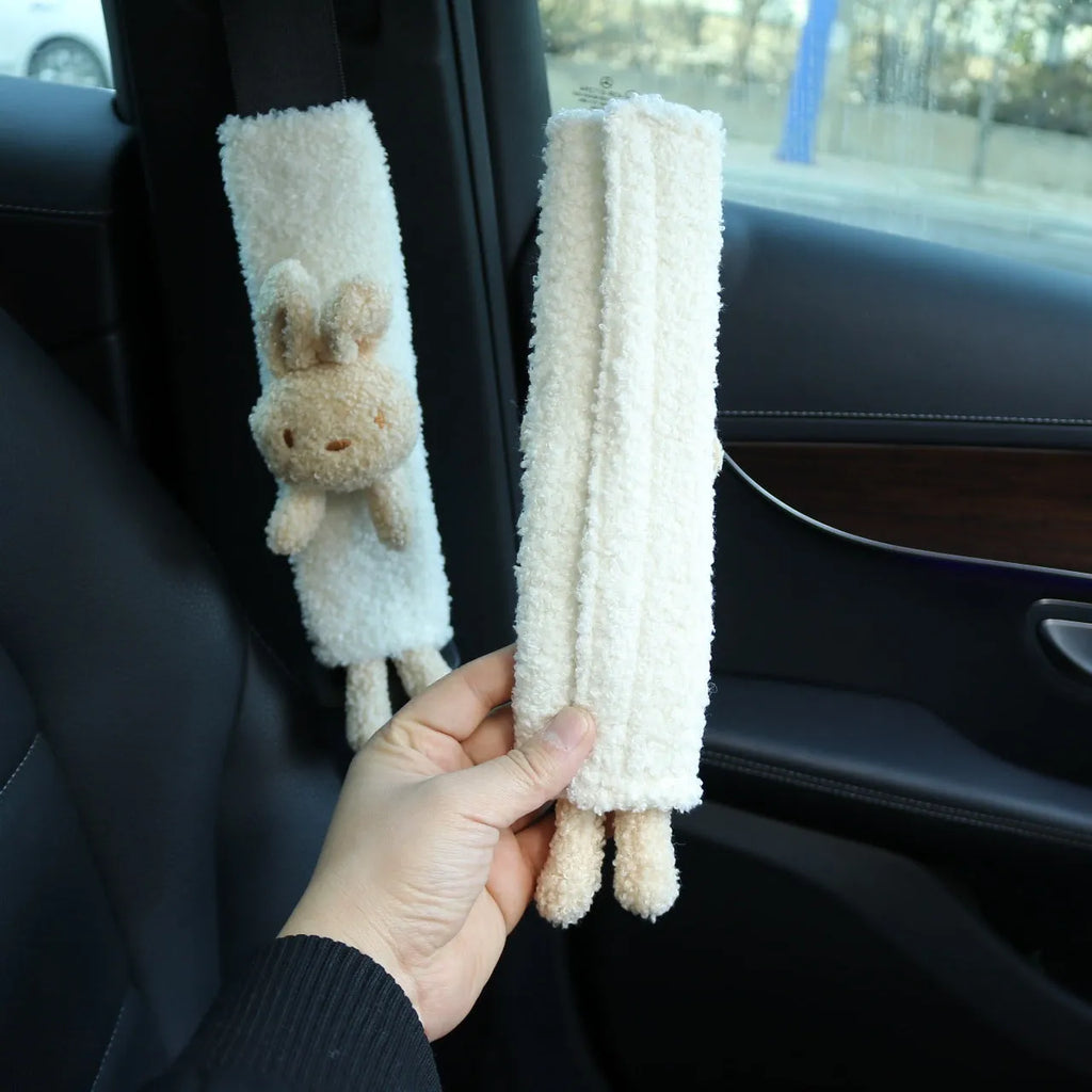 Cartoon plush lamb wool car seatbelt shoulder protector in bear and rabbit designs.
