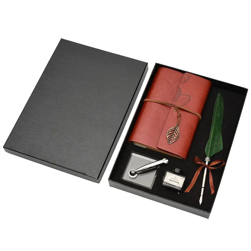 Feather dip pen gift set with copper pen, ink bottle, acrylic base, and antique book in box