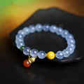Iced aquamarine crystal bracelet with geometric arrangement of 8mm stones and adjustable cord