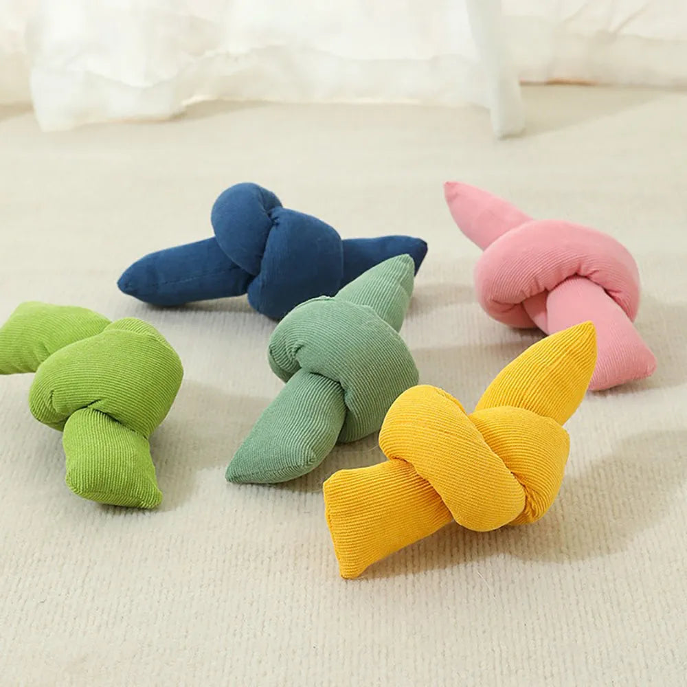 White knotted cotton dog rope toy for tug of war and dental flossing.