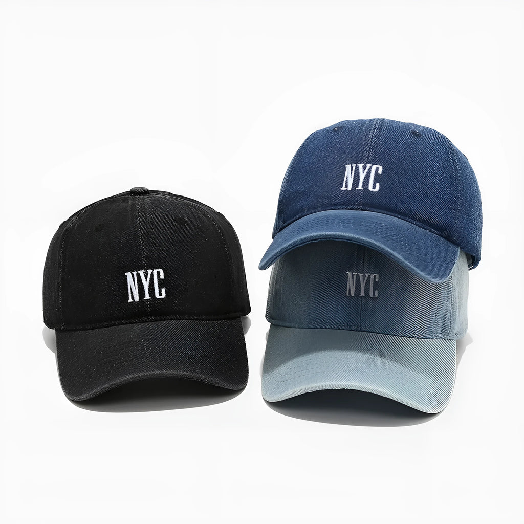 Adjustable denim peaked cap with a dome crown and a large English letter design on the front.