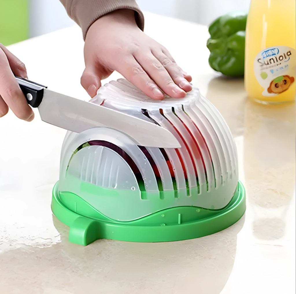 Blue salad cutter bowl with chopper lid and serving plate base for vegetable preparation