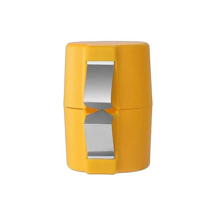 Colourful egg shell opener and beater kitchen tool made of stainless steel and plastic on a kitchen counter.