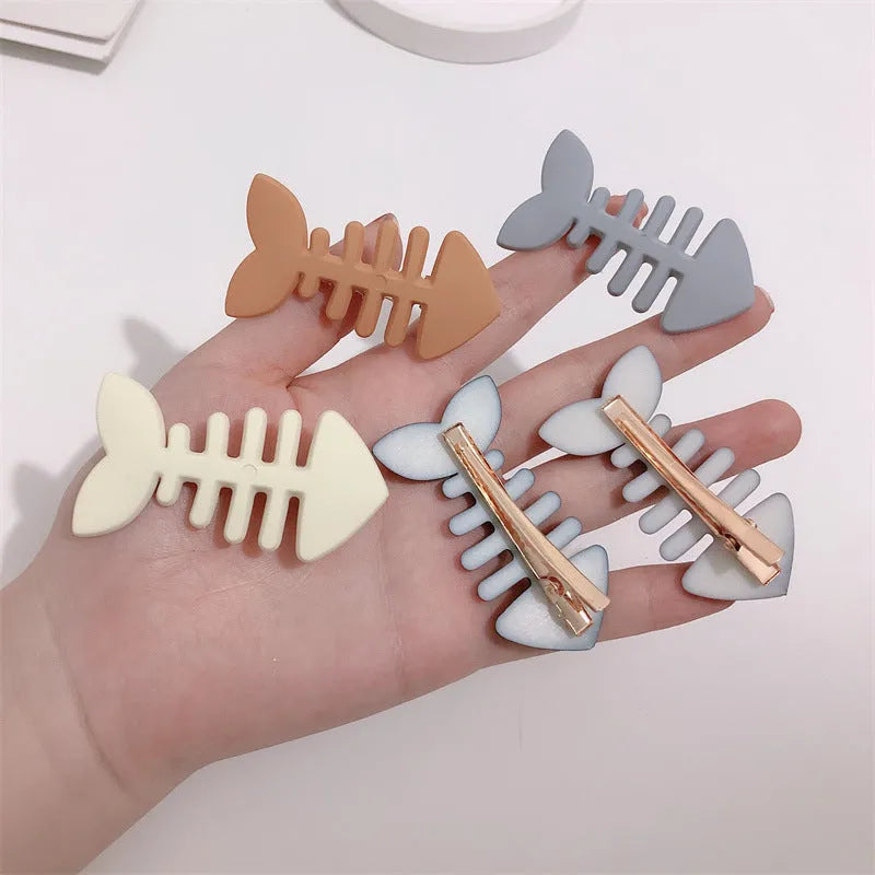 Minimalist fishbone pattern hair barrette with duckbill clip in a candy colour.