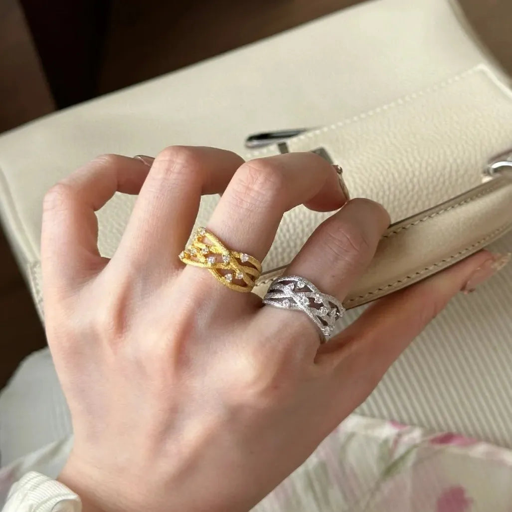 Women's adjustable copper ring with three-dimensional hollow vine cord design in gold electroplated finish