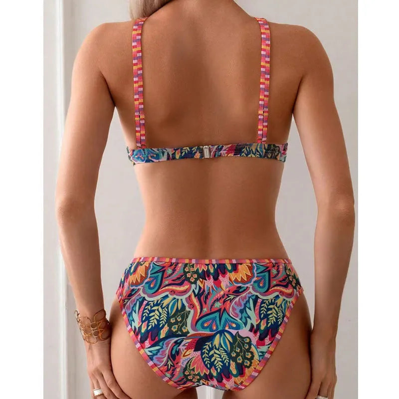 Women's printed halter neck beach swimsuit with high-cut leg, shown as separate top and bottom pieces.
