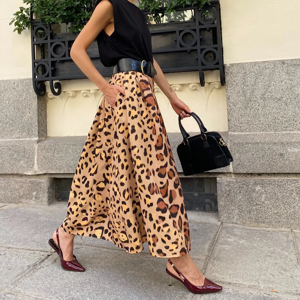 Brown leopard print A-line long skirt on a hanger, showing the flared hem and full length.