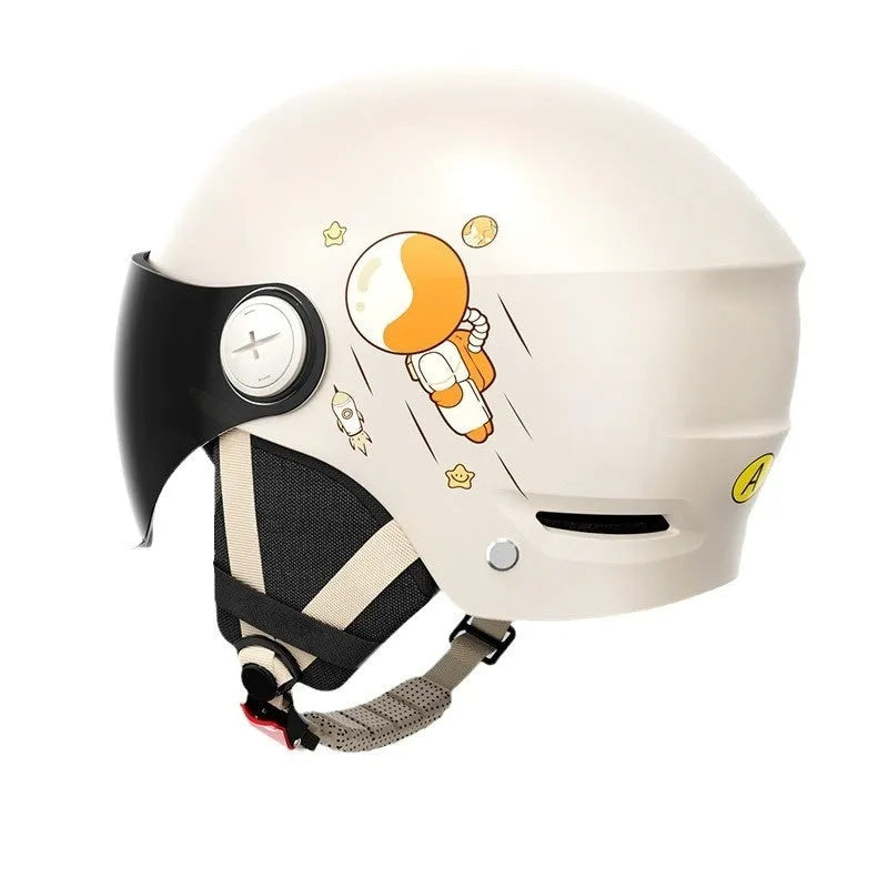 Khaki coloured electric motorcycle half helmet with a long mirrored visor on a table.