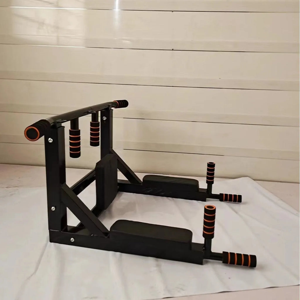 Black wall-mounted fitness station with sandbag rack, parallel bars, and a pull-up bar.