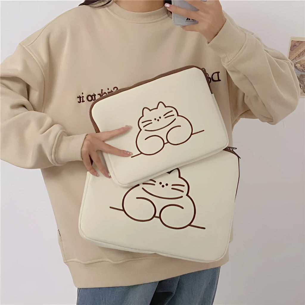 Fat cat embroidered design on a grey nylon laptop protective sleeve with a black zipper.