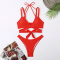 Solid colour women's brief bikini swimsuit on a mannequin, showcasing the strap design.