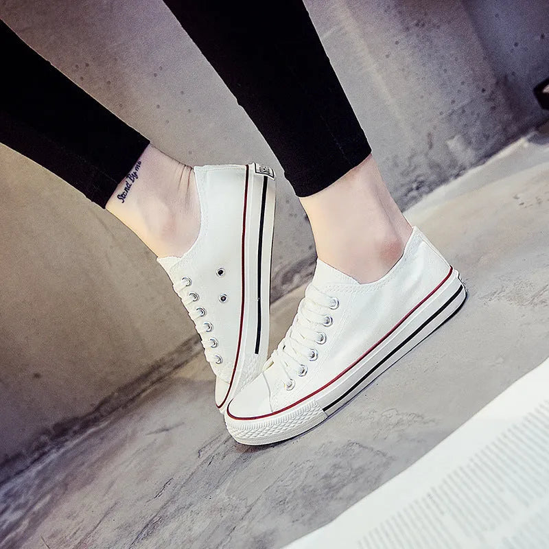 Women's solid colour canvas casual shoes in multiple colour options on a white background.