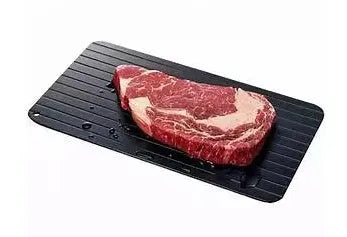 Black aluminium kitchen defrosting tray for thawing frozen meat and food without electricity