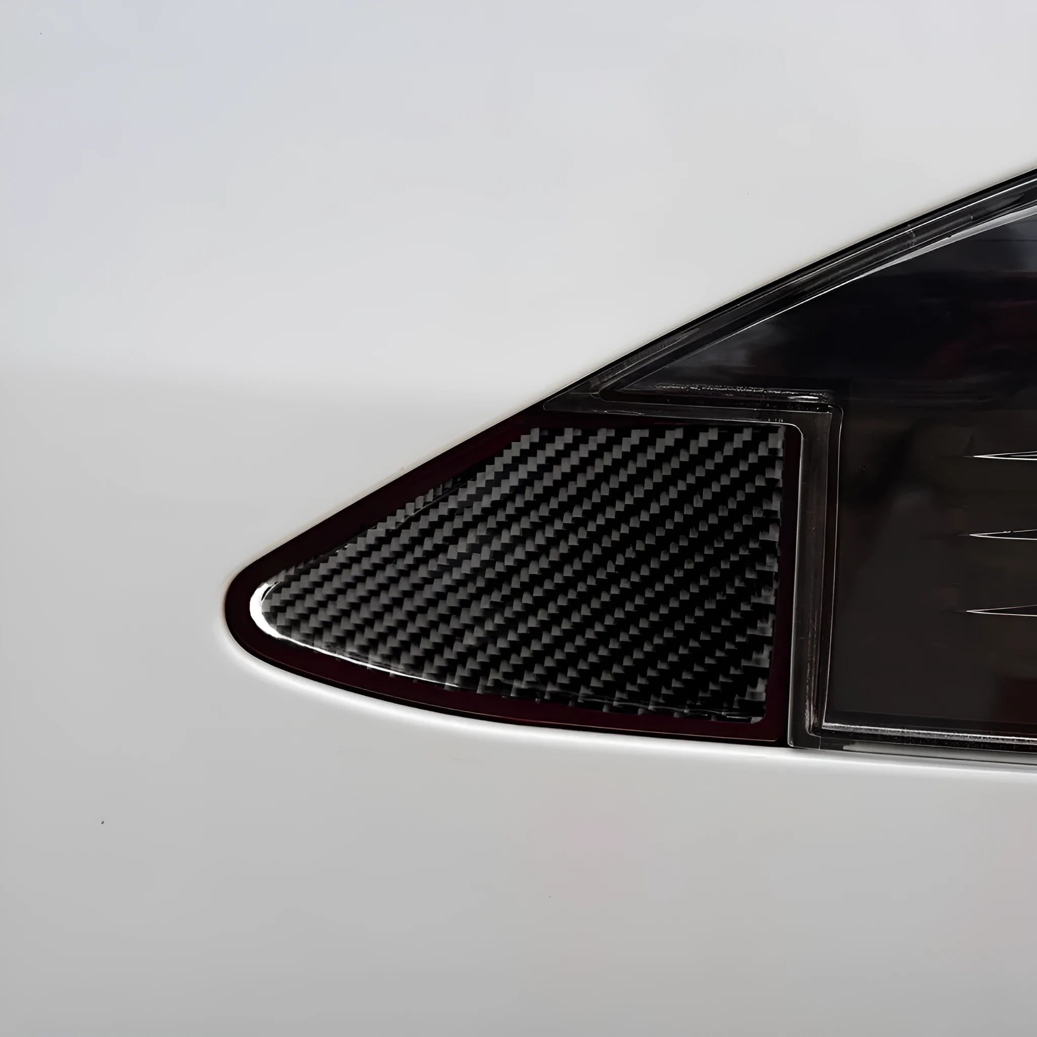 Carbon fibre patterned decorative sticker for vehicle USB charging port panel with 3M adhesive backing.