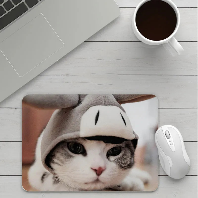 Thick custom cartoon mouse pad with colourful design on a desk, showing black seam edge